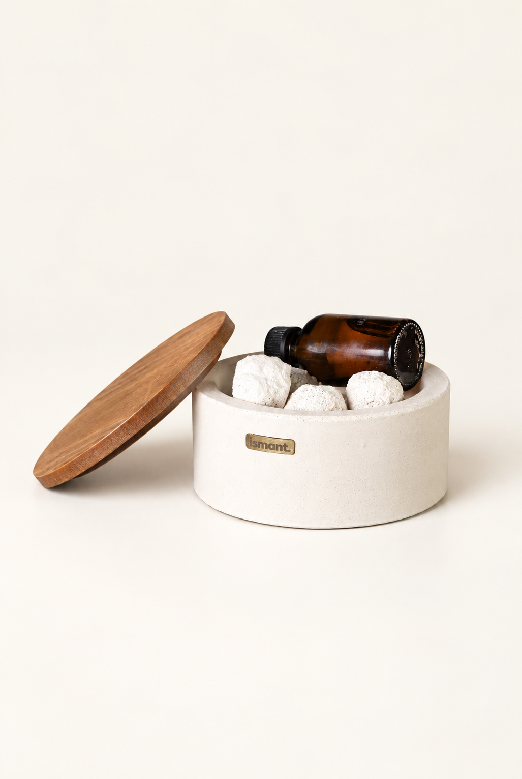 Diffuseur de parfum passif Ismant : boîte ronde en béton, couvercle en bois, pierres de perlite